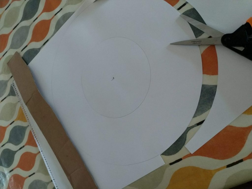 Drawing circles using cardboard compass toroidal book